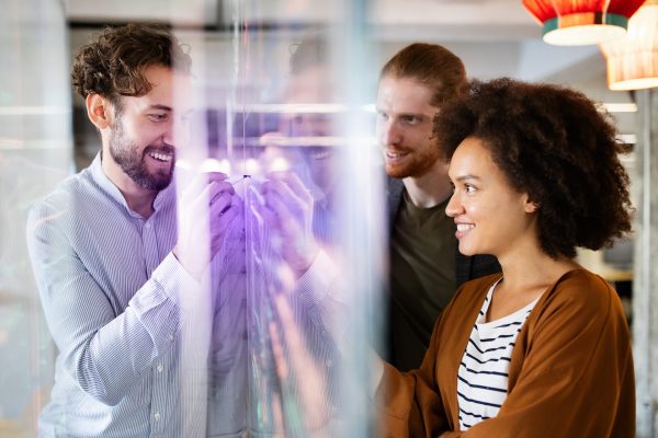 Programmers working cooperating at IT company developing apps